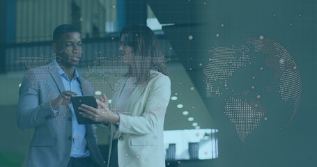 Image of world map and globe over diverse business people