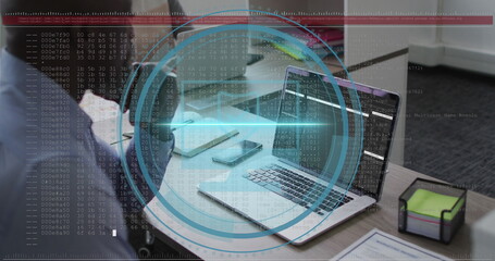 Image of data processing over african american businessman using laptop