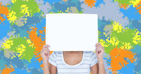 Image of caucasian woman with blank card over colourful stains