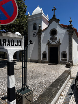 White church and street sign on the Camino de Santiago in Ara&uacute;jo, Portugal