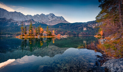 Calm morning scene of Eibsee lake with Zugspitze mountain range on background. Wonderful autumn view of Bavarian Alps, Germany, Europe. Beauty of nature concept background.