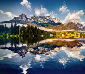 Reflexion of blue sky in the pure water of Hintersee lake.