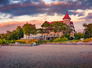 Fantastic summer sunrise on Leba castle, Pomeranian Voivodeship, Poland, Europe. Majestic morning view of the coast of Bultic Sea. Vacation concept background.