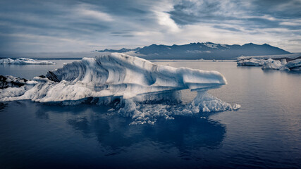 Floating of big iceberg in Jokulsarlon Glacier Lagoon. Dramatic summer view of Vatnajokull National Park. Picturesque morning scene of Iceland, Europe. Beauty of nature concept background.