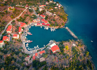 Stright down view of Vathi port. Wonderful morning scene of Peloponnese peninsula, Greece, Europe. Splendid summer seascape of Myrtoan Sea. Traveling concept background.