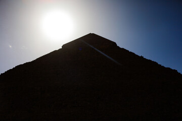 Silhouette of Egyptian Pyramid at Sunset in Giza