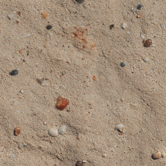 A seamless texture showcasing a light brown sandy surface with various small stones and pebbles