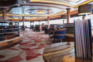 Cozy living room atmosphere inside cafe café coffee shop bar lounge bistro onboard luxury cruiseship cruise ship liner in contemporary Art Deco interior design