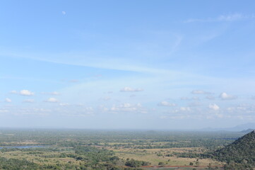 Beautiful natural green landscape from Mihintale mountain peak near Anuradhapura city in Sri Lanka in the afternoon with blue sky