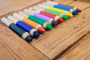 Colored pencils on a wooden background. background for inscriptions. School. September 1. Office....