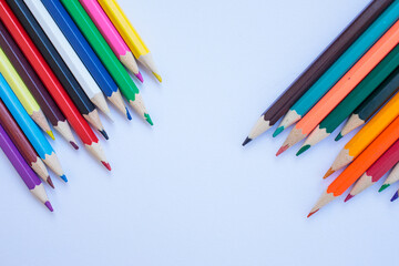 Colored pencils on a white background. background for inscriptions. School. September 1. Office. Study.