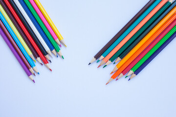 Colored pencils on a white background. background for inscriptions. School. September 1. Office. Study.