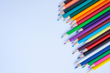 Colored pencils on a white background. background for inscriptions. School. September 1. Office. Study.