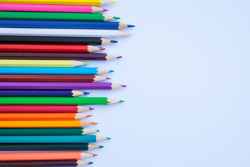 Colored pencils on a white background. background for inscriptions. School. September 1. Office. Study.