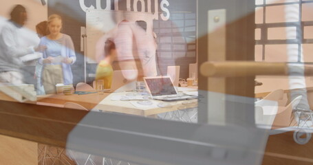 Image of person using computer over group of business people