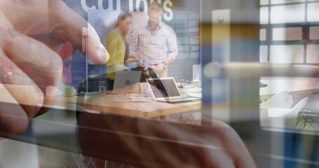 Image of person using smartwatch over group of business people