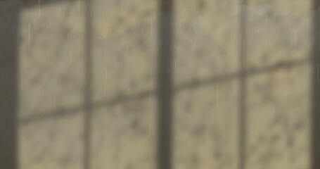 Image of clouds, rain and lightening shadows on grey wall
