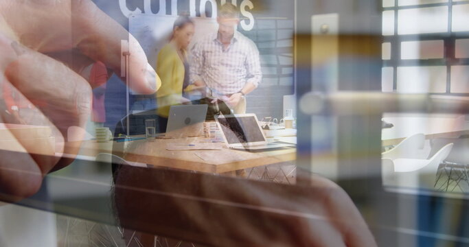 Image of person using smartwatch over group of business people