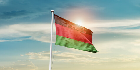 Malawi national flag waving in beautiful sky with mast. A proud moment flag waving with sunlight.