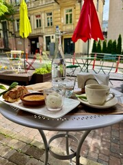 table setting at restaurant in the street, coffee and desserts