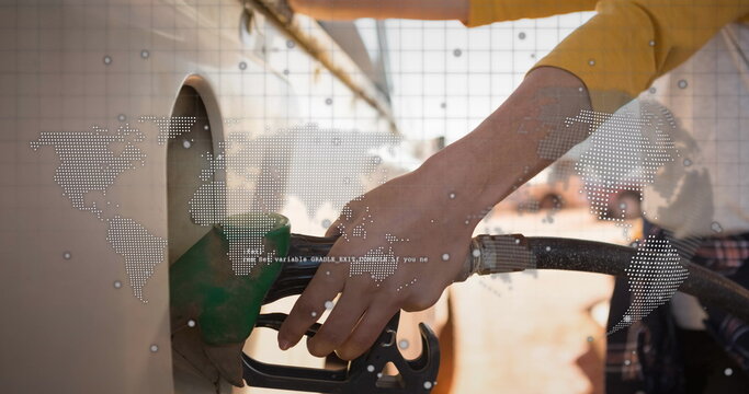 Image of world map and globe over caucasian women refueling