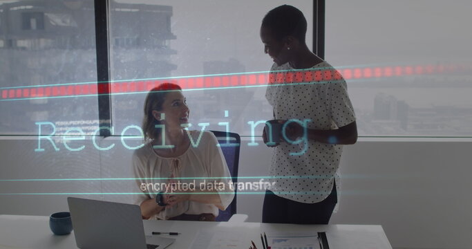 Image of receiving and data processing over diverse female coworkers in office