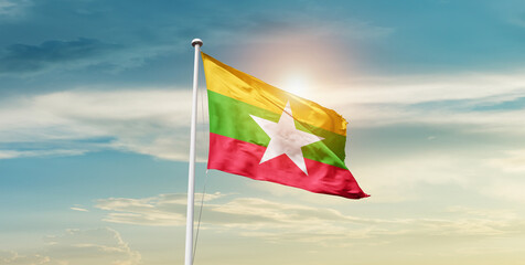 Myanmar national flag waving in beautiful sky with mast. A proud moment flag waving with sunlight.