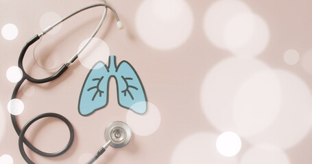 Image of spots over lungs and stethoscope