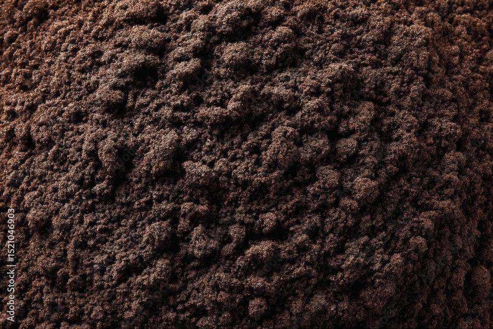 Poster ground coffee fills the surface with rich texture showcasing its deep brown color and fine grains du