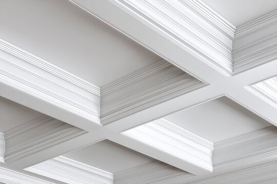 A stunning close-up of a white coffered ceiling that highlights intricate details, depth, and shadows from recessed panels and embellishments.
