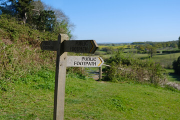 Wooden public footpath sign in the English countryside 