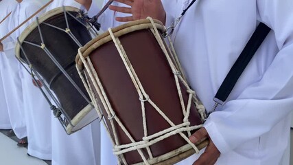 arabs in traditional dress dancing a traditional dance