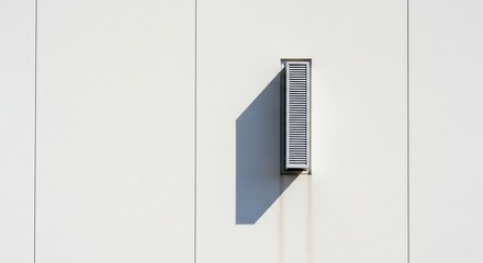 Minimalist Architectural Detail: Vent and Shadow on a White Wall