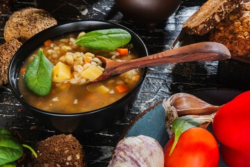 Homemade soup- dark photo. Background food- still life nosh. Serving meals in the home kitchen. Cook meals for the family
