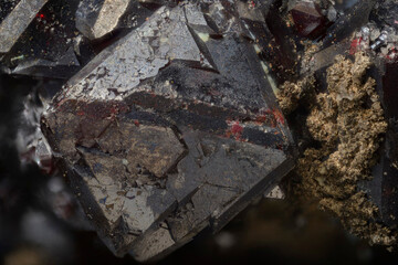 Mineral Cuprite (red copper ore) and silver crystals. Microphotography with high magnification- photo scale 10X