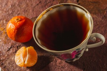 Still life - tea time. Mug of hot drink on a bright background - top view