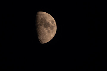 Detailed view of the waxing gibbous Moon against a black night sky. Surface craters and texture are clearly visible in this high-resolution astronomical photo.