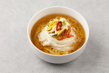  Janchi Guksu refers to noodles that are mainly eaten on feast days. It is a dish made with noodles in a hot clear soup and various toppings.