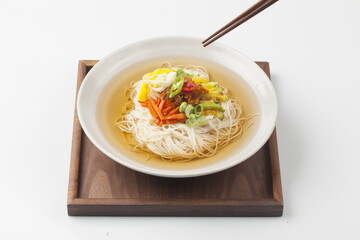  Janchi Guksu refers to noodles that are mainly eaten on feast days. It is a dish made with noodles in a hot clear soup and various toppings.