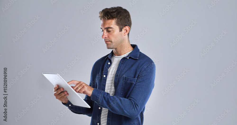 Fototapete Coding, system and tablet with man in studio for programming or software development career. App, search and web maintenance with serious tech guru on white background for professional IT support