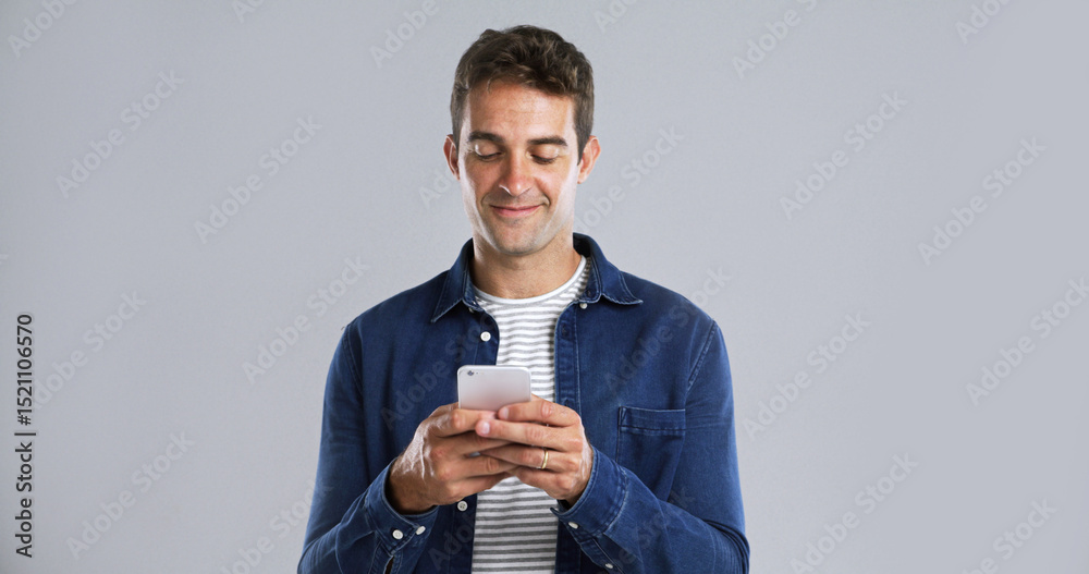 Poster Man, smartphone and typing for communication in studio, reading text message or web search. Writing email, notification or social media update for comment, smile and mobile app on white background