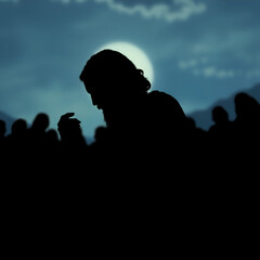 Silhouette of jesus deep in prayer at gethsemane moments before his betrayal and crucifixion
