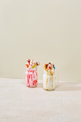 Vibrant Monster Milkshakes Against Minimalist Pastel Backdrop