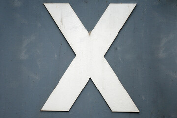 Capital X on a wall