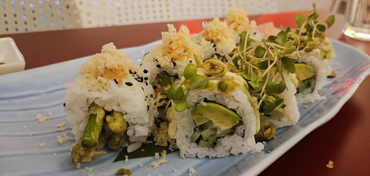 Asparagus sushi served in a plate in restaurant 