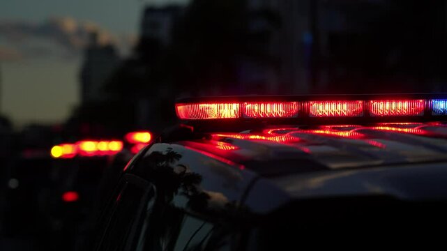 Police car lights flashing. Crime scene at night. Patrol vehicle outdoors. Emergency lights glowing. Flashing police siren. Police car vehicle. Law enforcement. City night patrol. Police arrest.