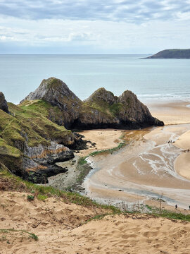 Fototapeta Three Cliffs Bay on the Gower Peninsular West Glamorgan Wales which is a popular Welsh coastline attraction travel destination of outstanding beauty in the UK, vacations stock photo image