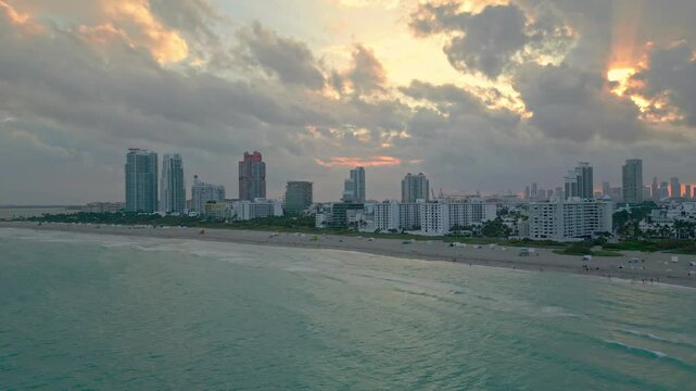 Summer in Miami from drone. Miami beach coastline. Panoramic view of Luxury condos in Miami Beach Florida. Aerial View of Surfside Miami Beach.