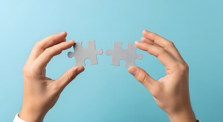 Hands delicately hold two puzzle pieces, representing collaboration, problem-solving, and the quest for completion. This image conveys the essence of teamwork, connection.