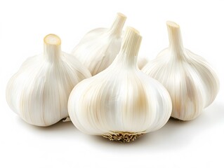 A close up studio shot of four whole garlic bulbs with white skin on a white surface in bright lighting